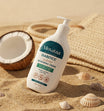 Moovataa Diabetics moisturizing cream bottle on a sandy background with a coconut and shells.